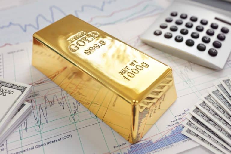 Gold bullion bar on a stocks and shares chart