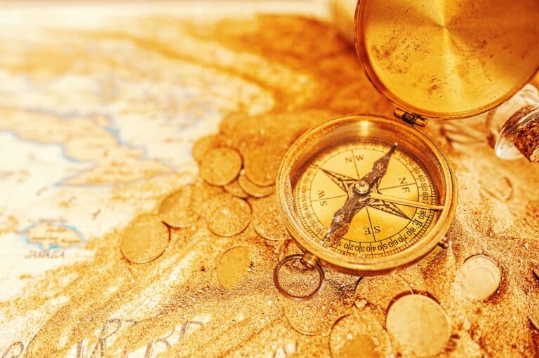 Treasure map with compass and gold coins